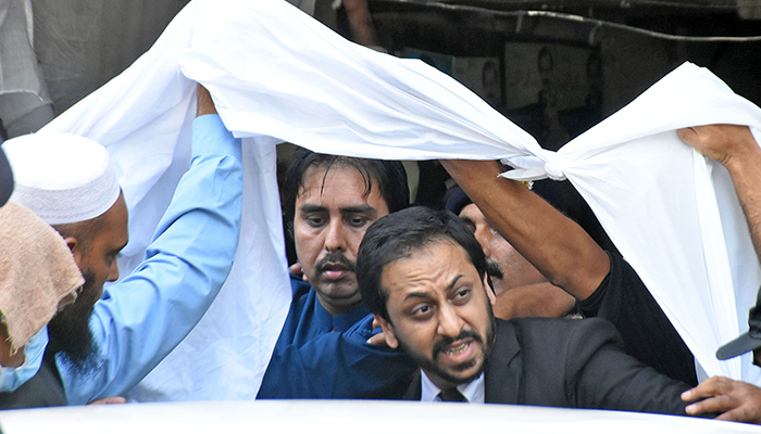 PTI leader Shahbaz Gill leaves district court after a hearing in Islamabad, on August 22, 2022. — Online