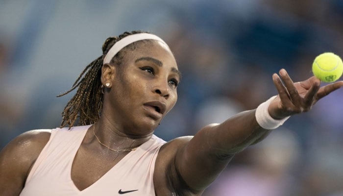 Serena Williams servers the ball to Emma Raducanu during their first-round match at the Cincinnati Open on Monday. Reuters