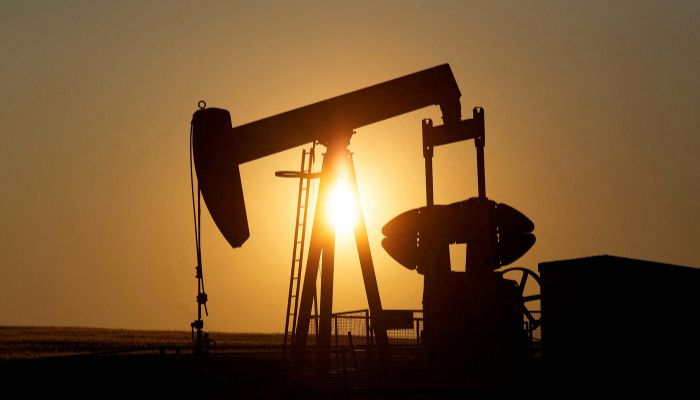 An oil pump jack pumps oil in a field near Calgary, Alberta, Canada on July 21, 2014. — Reuters