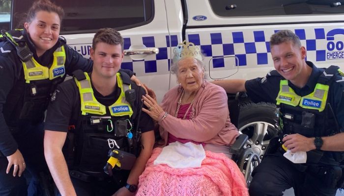 Three police constables with 100-year-old Jean. — Facebook