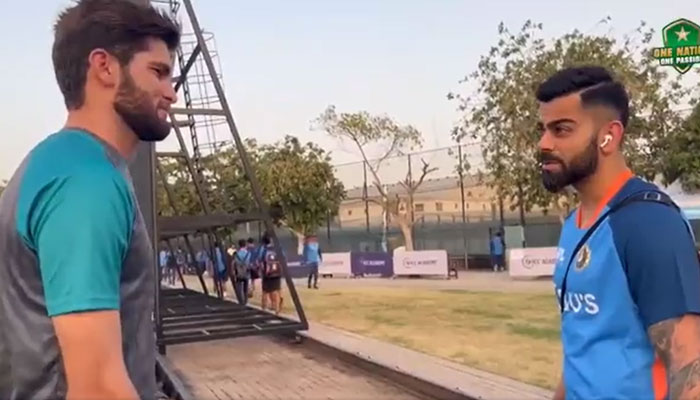 Shaheen Afridi welcomes Virat Kohli during a practice session on August 25, 2022. Screengrab of a PCB video on Twitter.