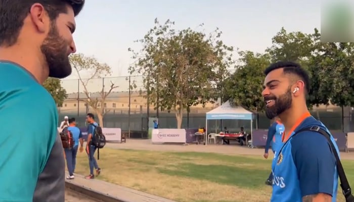 Former Indian skipper Virat Kohli (right) speaks to pacer Shaheen Afridi in the United Arab Emirates, on August 25, 2022. — Twitter