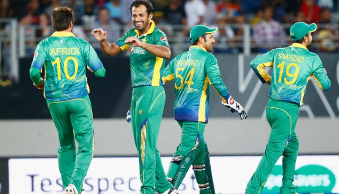 (L-R) Pakistan cricketers Shahid Afridi, Wahab Riaz, Sarfaraz Ahmed, and Ahmed Shahza celebrate after taking a wicket of the opposition team during one of the matches of Asia Cup 2016. — Twitter/File