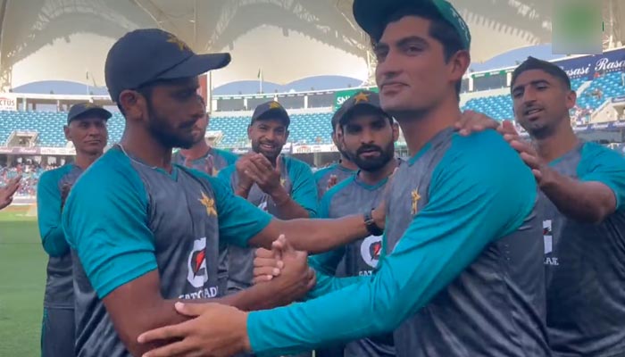 Pakistan pacer Naseem Shah being congratulated on his T20I debut against India at the Dubai stadium, on August 28, 2022. — Twitter/TheRealPCB