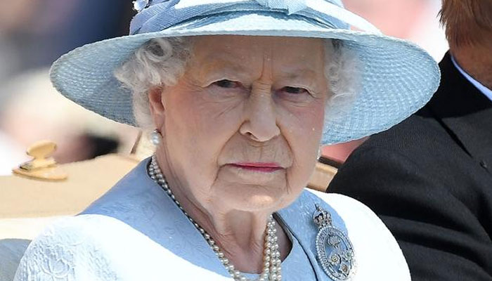 Queen Elizabeth II travels in a horse-drawn carriage on her way for the Queens Birthday Parade. — AFP/File