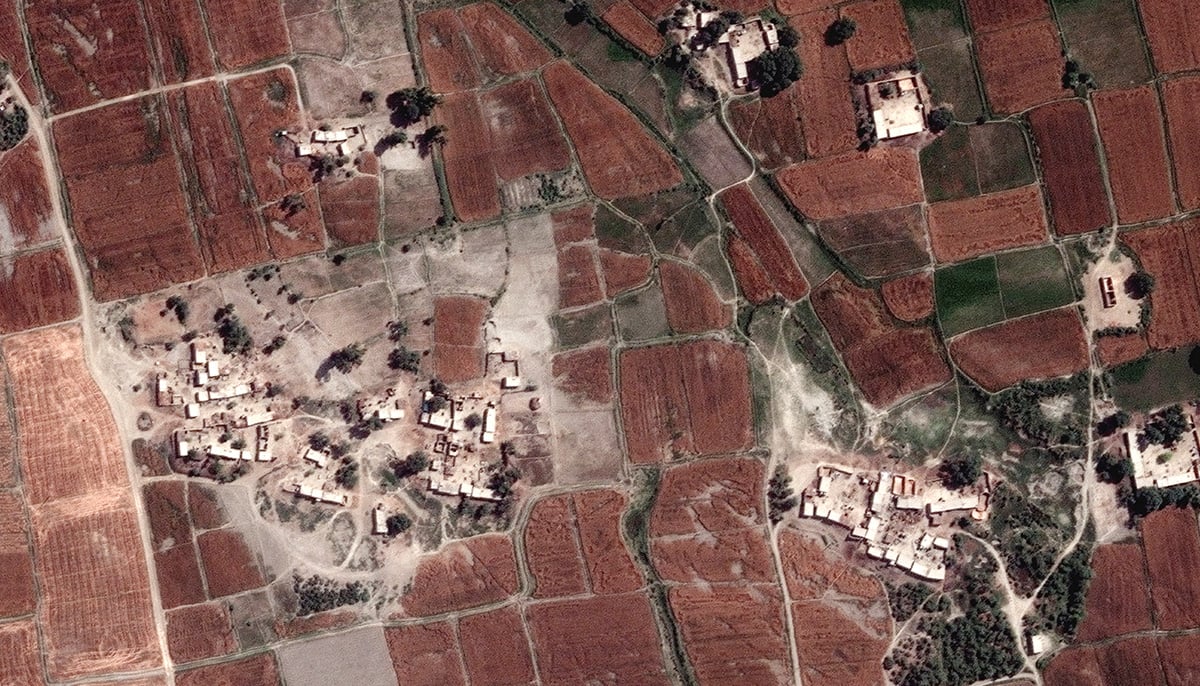 A close up view shows homes and fields before flooding, in Rajanpur, Pakistan, March 24, 2022. — Reuters