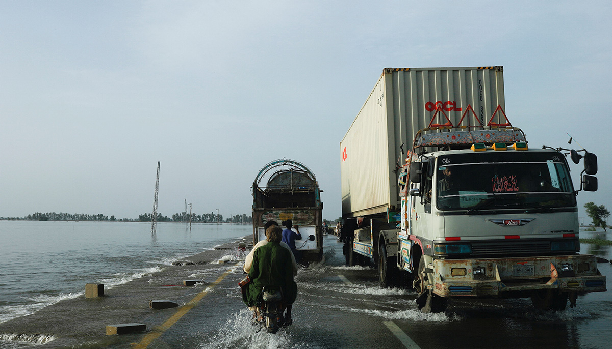 Vehicles move along a flooded road, following rains and floods during the monsoon season in Mehar, Pakistan August 29, 2022. — Reuters