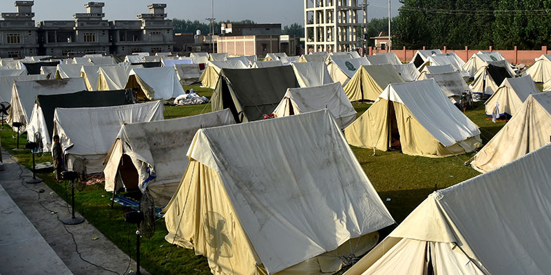 A general view shows tents installed for displaced people at a makeshift camp after they fled from their flood hit homes following heavy monsoon rains in Charsadda district of Khyber Pakhtunkhwa on August 29, 2022. — AFP