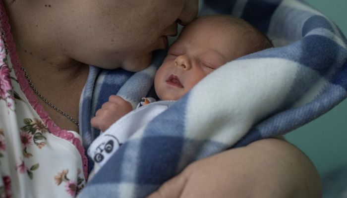 Iryna Salamatina, 36, kisses her son Anton inside Pokrovsk maternity hospital, Donetsk region, eastern Ukraine, June 28, 2022. Doctors at the centre anecdotally observed that the smouldering conflict, which would kill more than 14,000 people between 2014 and 2022, was having an impact on pregnancies. — Reuters