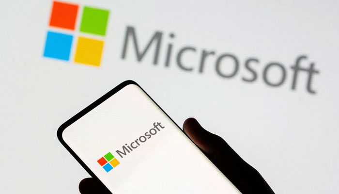 Smartphone is seen in front of Microsoft logo displayed in this illustration taken, July 26, 2021. — Reuters