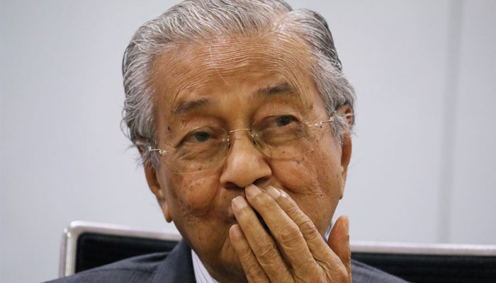 Malaysias former Prime Minister Mahathir Mohamad reacts during a news conference in Kuala Lumpur, Malaysia December 14, 2020.