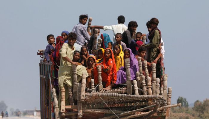 Flood victims travel with their belongings in search for a higher ground, following rains and floods during the monsoon season in Gari Yasin, Shikarpur, Pakistan August 31, 2022. — Reuters