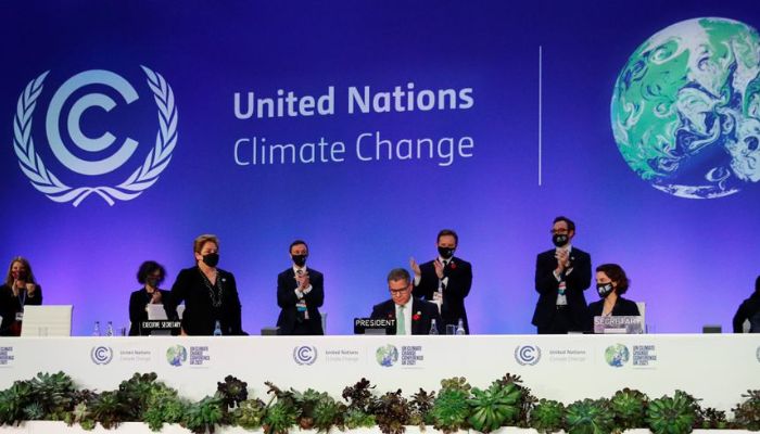 COP26 President Alok Sharma receives applause during the UN Climate Change Conference (COP26) in Glasgow, Scotland, Britain November 13, 2021. — Reuters