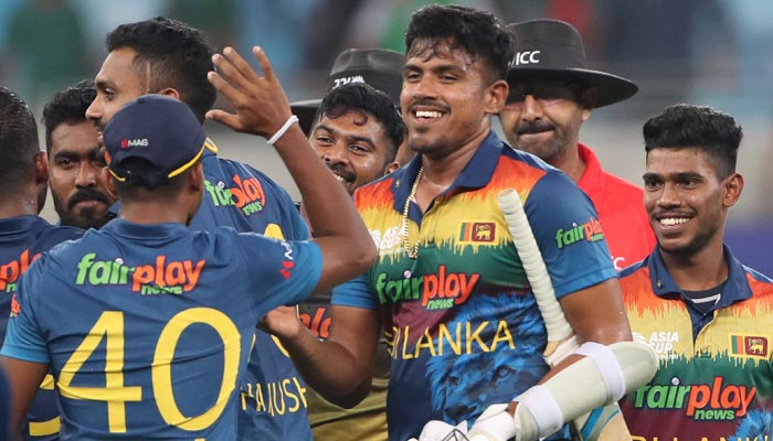 Sri Lankas players celebrate their win as Bangladeshs captain Shakib Al Hasan walks past them during the Asia Cup Twenty20 international cricket match between Bangladesh and Sri Lanka at the Dubai International Cricket Stadium in Dubai on September 1, 2022. — AFP