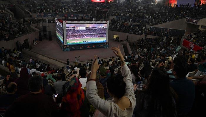 Cricket fans watch the live telecast of the Asia Cup Twenty20 international cricket match between India and Pakistan in Dubai, on big screens in Lahore on August 28, 2022. — AFP/File