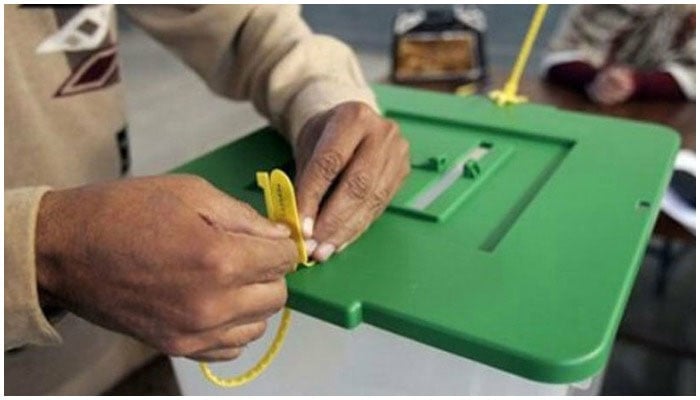 A polling staff member seals a ballot box. Photo: APP/ file