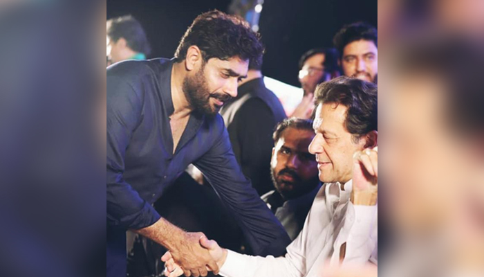 PTI leader and singer Abrar-ul-Haq (left) shakes hands with PTI Chairman Imran Khan in this undated photo. — Facebook/AbrarUlhaqOfficialOne