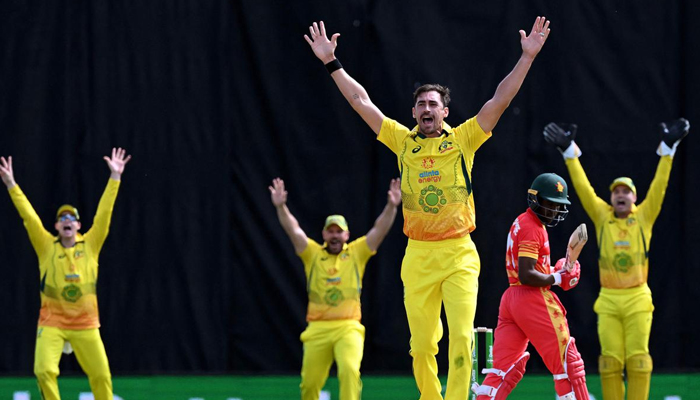 Australias pacer Mitchell Starc is in action against Zimbabwe. — AFP