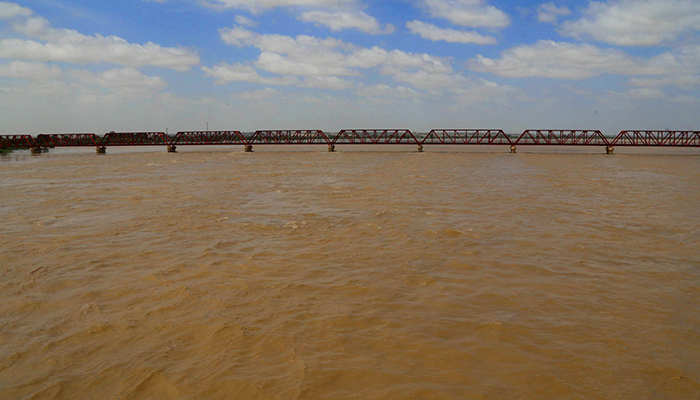 A view of increased water at Indus River after flooding at Kotri Bridge, on September 2, 2022. — APP