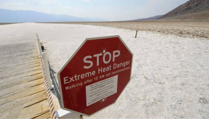 Sign warns of extreme heat at the Badwater Basin salt flats inside Death Valley National Park in California. —  AFP