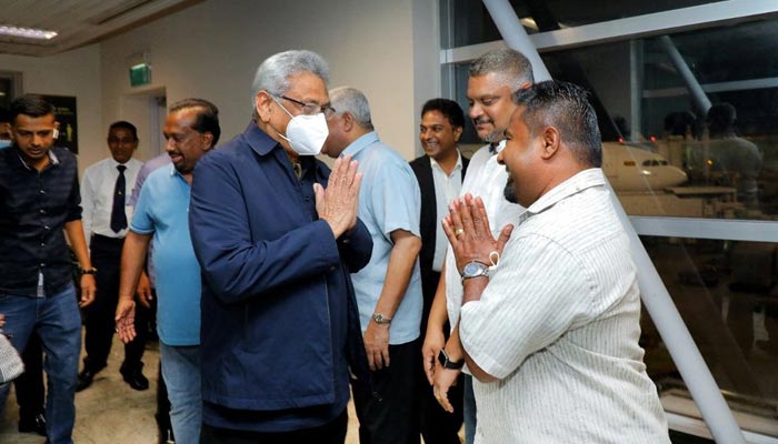 Sri Lankas ousted President Gotabaya Rajapaksas party members welcome him and his wife Ioma Rajapaksa at the Bandaranaike International Airport as he returns to the country after he had fled during the July economic unrest and protestors stormed in the presidents house in Katunayake, Sri Lanka, September 2, 2022. — Reuters