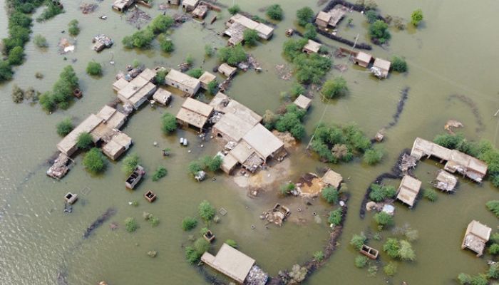 This aerial view shows a flooded residential area in Dera Allah Yar town after heavy monsoon rains in Jaffarabad district, Balochistan province on August 30, 2022.— AFP
