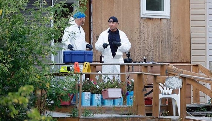 A police forensics team investigates a crime scene after multiple people were killed and injured in a stabbing spree in Weldon, Saskatchewan, Canada. September 4, 2022. Photo: Reuters
