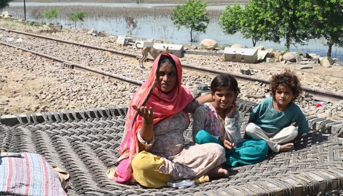 Fahmidah Bibi sleeps in the open, sharing a traditional wooden charpoy bed with her five children, aged four to 12. — AFP