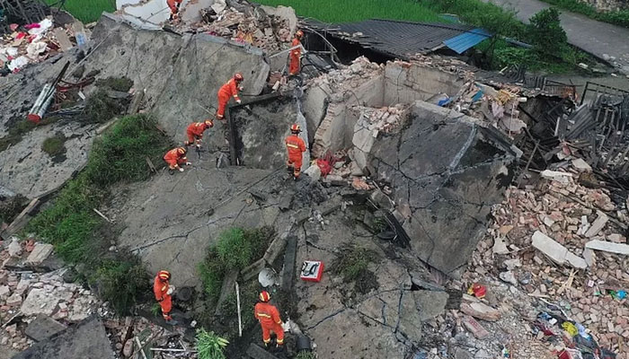 An aerial view of several buildings collapsed, trapping people underneath in one of the most horrific earthquakes in China. — Reuters/File