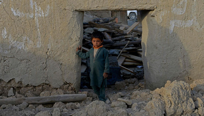 A boy stands inside a damaged house after a recent earthquake at Akhtar Jan village in Gayan district of Paktika province, Afghanistan, June 25, 2022. — Reuters
