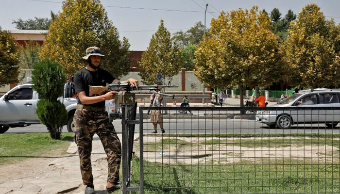 A Taliban fighter stands guard after a blast in front of the Russian embassy in Kabul, Afghanistan, September 5. — Reuters