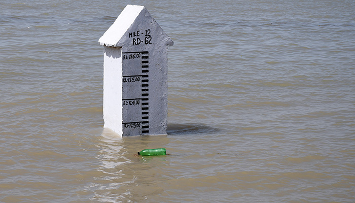 A gauge shows the water level, following rains and floods during the monsoon season in Manchar Lake, Bhan Syedabad, Pakistan, September 3, 2022. — Reuters