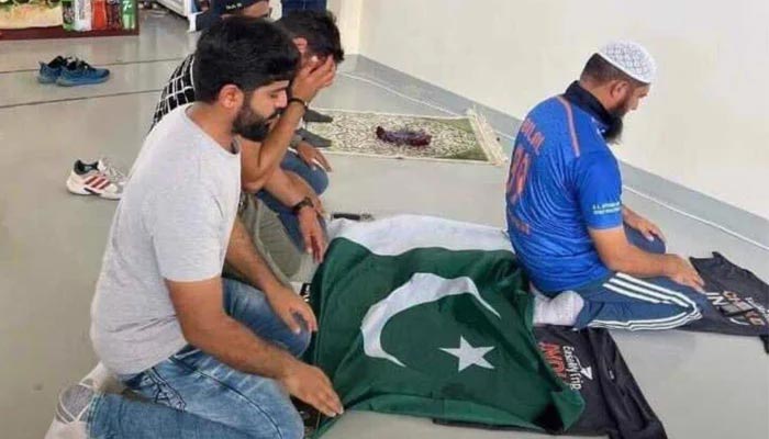 Pakistani and Indian fans praying together at Dubai International Stadium. — Twitter