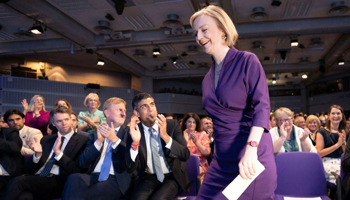 Rishi Sunak claps as Liz Truss takes to the stage at the Queen Elizabeth II Centre on the day it is announced that she is the new Conservative party leader, and will become the next Prime Minister, in London, Britain September 5, 2022. Reuters