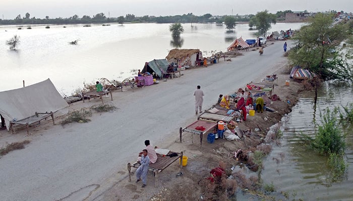 This aerial photograph taken on September 5, 2022, shows the makeshift tents of internally displaced flood-affected people after heavy monsoon rains at Dera Allah Yar town in Jaffarabad district of Balochistan province. — AFP