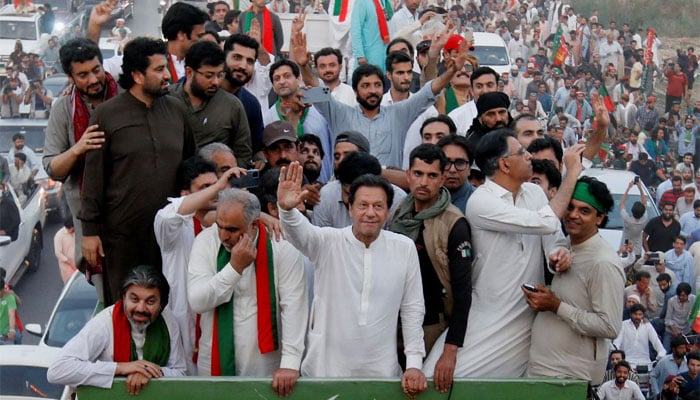 Ousted Pakistani Prime Minister Imran Khan gestures as he travels on a vehicle to lead a protest march in Islamabad, Pakistan May 26, 2022. — Reuters