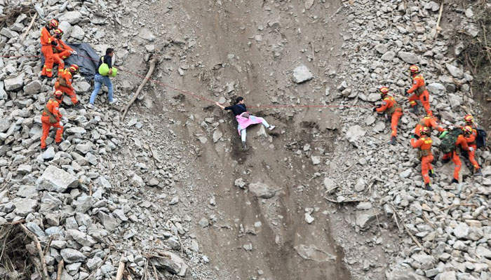 Rescue workers evacuate quake-affected residents at the site of a landslide near Moxi town, following a 6.8-magnitude earthquake in Luding county, Ganzi Tibetan Autonomous Prefecture, Sichuan province, China September 6, 2022. — Reuters