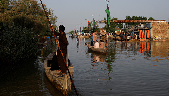 Pakistan looks 'like a sea' after floods, PM Shehbaz says, as 18 more die 11 Residents use boats as they travel amid flood water, following rains and floods during the monsoon season in Bajara village, at the banks of Manchar lake, in Sehwan, Pakistan September 6, 2022. — Reuters