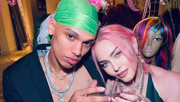Madonna seen getting cosy with 23-year-old model Andrew Darnell