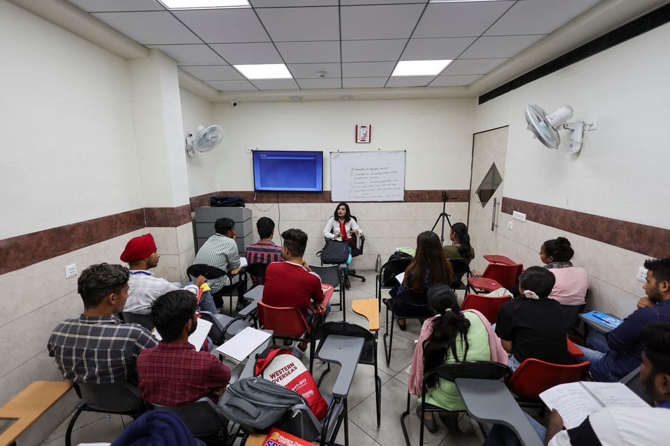 Students attend an International English Language Testing System (IELTS) class conducted by Western Overseas, an institute providing coaching for English language proficiency tests and visa consultancy, in Ambala, India, August 4, 2022. — Reuters
