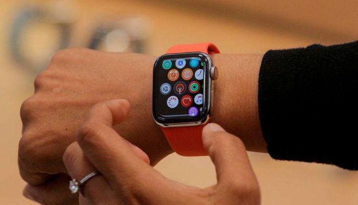 An Apple Store employee shows the Series 5 Apple Watch during the preview of the redesigned and reimagined Apple Fifth Avenue store in New York, U.S., September 19, 2019.— Reuters