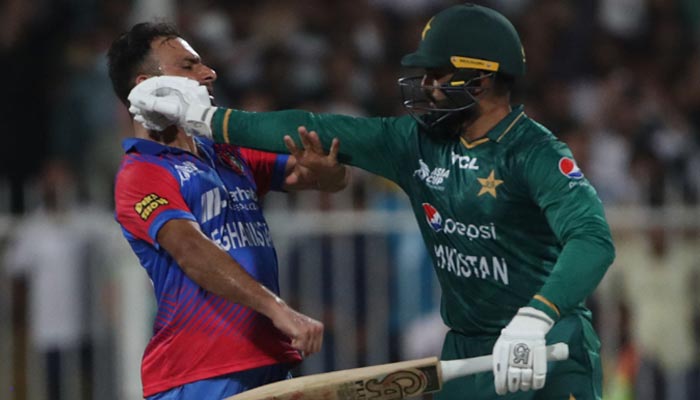 Pakistans Asif Ali (R) and Afghanistans Fareed Ahmad argue after a dismissal during the Asia Cup Twenty20 international cricket Super Four match between Afghanistan and Pakistan at the Sharjah Cricket Stadium in Sharjah on September 7, 2022. — AFP