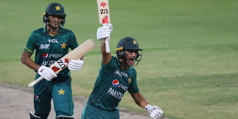 Naseem Shah (R) celebrates after hitting a boundary to win the Asia Cup Twenty20 international cricket Super Four match between Afghanistan and Pakistan at the Sharjah Cricket Stadium in Sharjah on September 7, 2022. — AFP