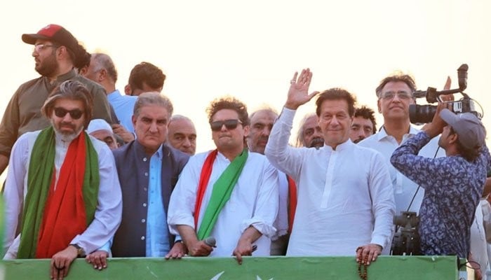 A file photo of PTI Chairman Imran Khan with other leaders from the party. —PTI facebook