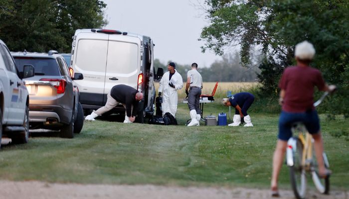 A police forensics team investigates a crime scene after multiple people were killed and injured in a stabbing spree in Weldon, Saskatchewan, Canada. September 4, 2022 — Reuters