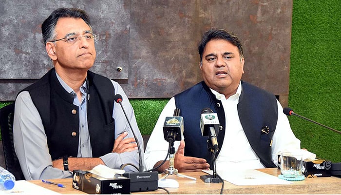 Former federal ministers and PTI leaders Fawad Hussain Chaudhry and Asad Umar addressing a press conference in Islamabad, on March 29, 2022. — APP