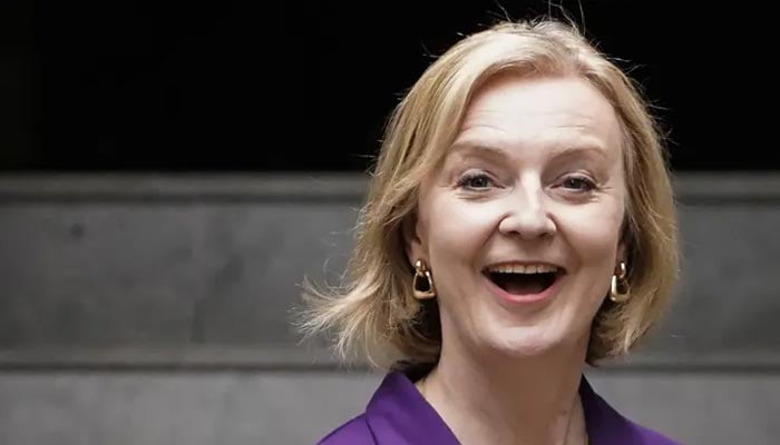 Prime minister Liz Truss reacts as she leaves the Conservative Party Headquarters in central London on September 5, 2022. 1 AFP/File