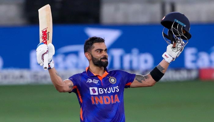 Indias Virat Kohli celebrates after scoring a century (100 runs) during the Asia Cup Twenty20 international cricket Super Four match between Afghanistan and India at the Dubai International Cricket Stadium in Dubai on September 8, 2022. — AFP