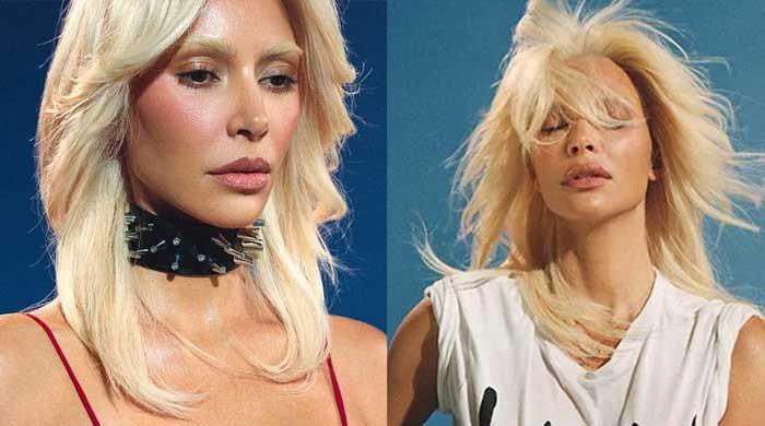 Kim Kardashian looks unrecognisable as she channels her inner glamour model