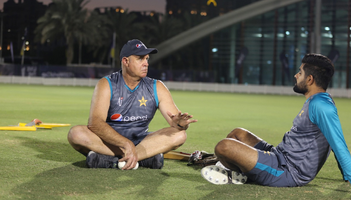 Australian legend Matthew Hayden (left) speaks to Pakistan skipper Babar Azam during a training session in this undated photo. — Twitter/PCB